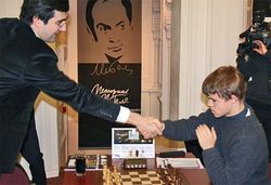 a er eins og Carlsen nenni ekki taka  hendina  Kramnik!